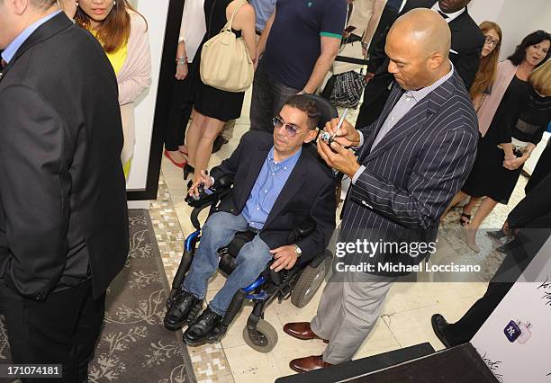 Professional Baseball Player Mariano Rivera signs EDT bottles during The Mariano Rivera Signature Limited Edition EDT At Lord & Taylor on June 21,...