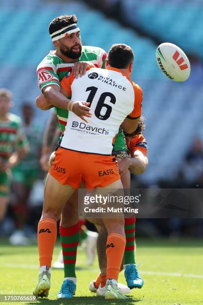 Shaquai Mitchell of the Rabbitohs offloads the ball in a tackle during the 2023 NRL State Championship Grand Final match between South Sydney...