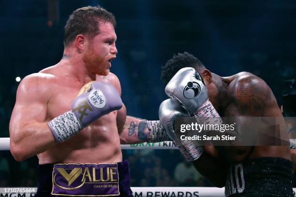 Saul "Canelo" Alvarez of Mexico trades punches with Jermell Charlo during their super middleweight title fight at T-Mobile Arena on September 30,...