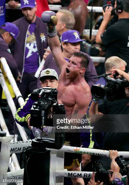 Undisputed super middleweight champion Canelo Alvarez celebrates his unanimous-decision victory over Jermell Charlo in their super middleweight title...