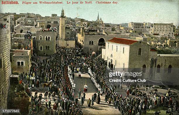 Christmas day in Bethlehem, late 1800s, early 1900s. Pilgrims watch procession to the Church of the Nativity.