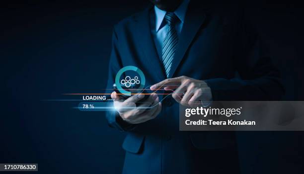 download and installation of latest software improve security and functionality. - computer loading stock pictures, royalty-free photos & images
