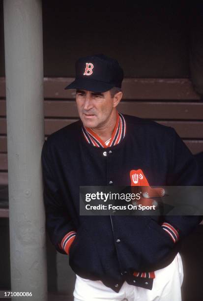 Manager Johnny Pesky of the Boston Red Sox looks on from the dugout during a Major League Baseball game circa 1963 at Fenway Park in Boston,...