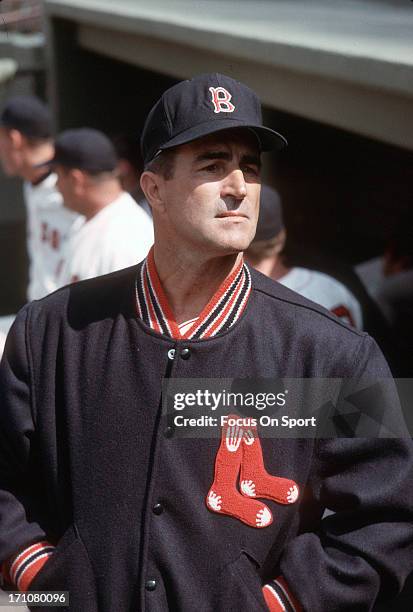 Manager Johnny Pesky of the Boston Red Sox looks on from the dugout during a Major League Baseball game circa 1963 at Fenway Park in Boston,...