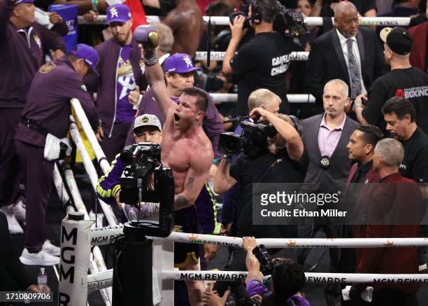 Undisputed super middleweight champion Canelo Alvarez celebrates his unanimous-decision victory over Jermell Charlo in their super middleweight title...