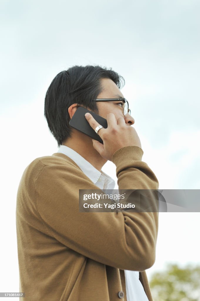 Man using the smartphone outdoors,Kyoto,Japan