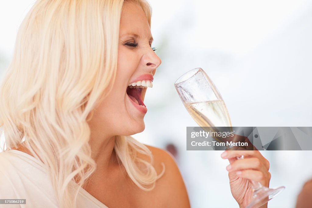 Woman drinking champagne