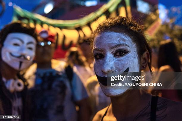 Make-up woman is seen during a demonstration in Belo Horizonte, Brazil, on June 21, 2013. Brazil's embattled president Dilma Rousseff was to address...