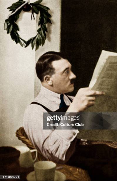 Reading newspaper in Landsberg Prison,1924 Ruler of the Third Reich. Early in his career as politician
