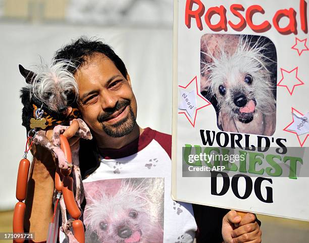 Dane Andrew shows his dog Rascal, a Chinese Crested, before the World's Ugliest Dog competition in Petaluma, California, on Friday, June 21, 2013....