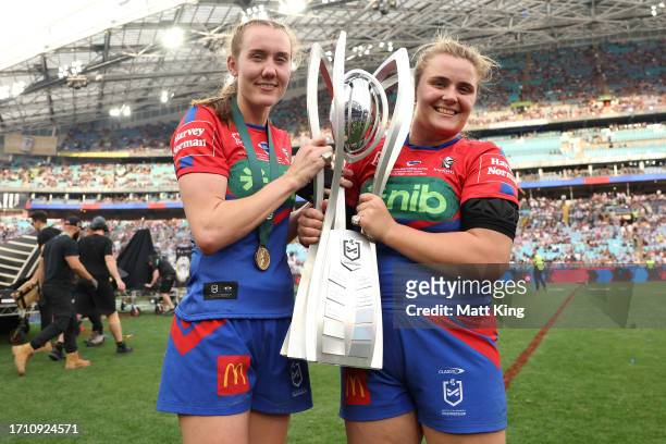 Tamika Upton and Hannah Southwell of the Knights pose with the Premiership Trophy after winning the 2023 NRLW Grand Final match between Newcastle...