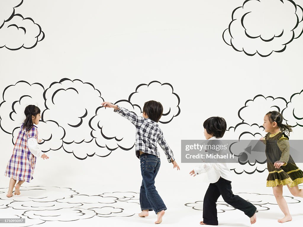 Children running  on the clouds