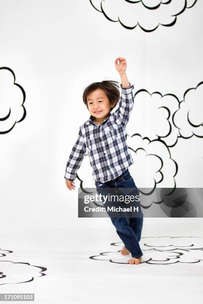 children running  on the clouds - 少年 ストックフォトと画像