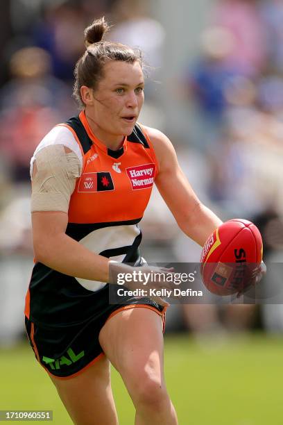 Rebecca Beeson of the Giants runs with the ball during the round five AFLW match between North Melbourne Tasmania Kangaroos and Greater Western...