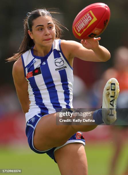 Taylah Gatt of the Kangaroos kicks the ball during the round five AFLW match between North Melbourne Tasmania Kangaroos and Greater Western Sydney...