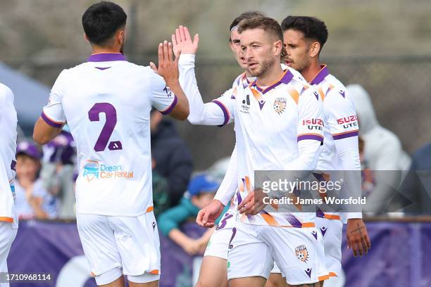 Adam Taggart of the Glory high fives his team mates after a goal during the A-League Mens pre-season match between Perth Glory and Melbourne Victory...