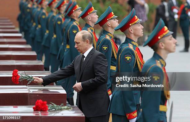 Russian President Vladimir Putin attends a wreath laying ceremony at the Tomb of the Unknown Soldier in Alexander Garden near the Kremlin on June...