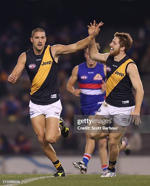 Shaun Grigg of the Tigers celebrates after kicking a goal during the round 13 AFL match between the Western Bulldogs and the Richmond Tigers at...