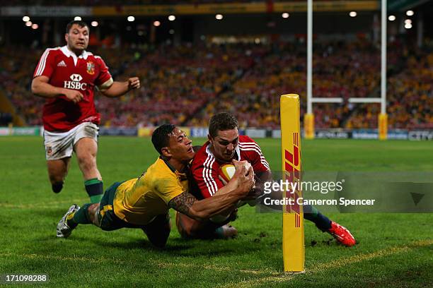 Israel Folau of the Wallabies tackles George North of the Lions as he attempts to score a try unsuccessfully during the First Test match between the...