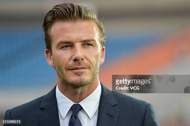 David Beckham arrives at the Yellow Dragon Sports Center prior to the Chinese Super League between Hangzhou Greentown and Beijing Guoan on June 22,...