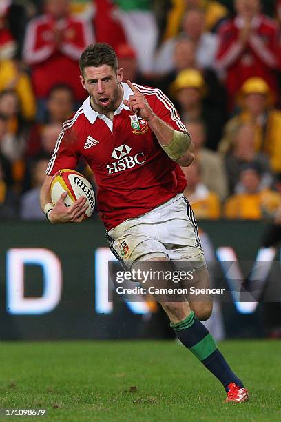 Alex Cuthbert of the Lions celebrates as he scores a try during the First Test match between the Australian Wallabies and the British & Irish Lions...