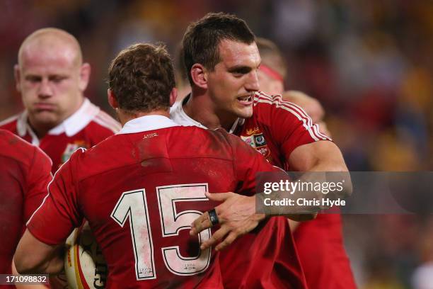 Leigh Halfpenny and Sam Warburton of the British & Irish Lions celebrate winning the First Test match between the Australian Wallabies and the...