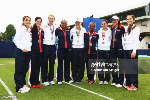 The victorious USA team poses with the Great Britain team Gabriella Taylor, Jamie Loeb, Katie Boulter, Taylor Townsend, Harriet Dart, Alicia Black,...