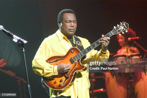 American jazz and R&B musician George Benson performs with his band on stage at the Oriental Theater, Chicago, Illinois, May 1, 2004.