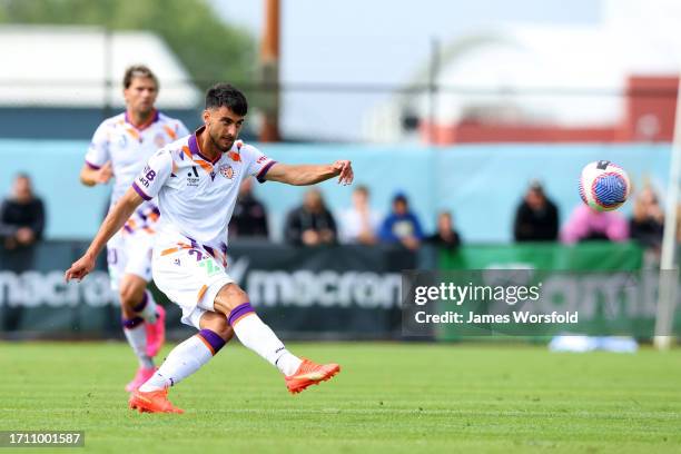 John Koutroumbis of the Glory passes the ball down the field during the A-League Mens pre-season match between Perth Glory and Melbourne Victory at...