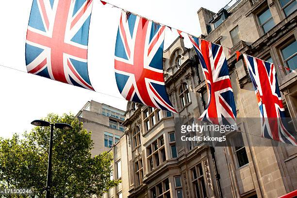 london architecture: preparation for the queen's diamond jubilee - old uk flag stockfoto's en -beelden