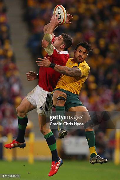 Alex Cuthbert of the British & Irish Lions catches the ball whilst tackled by Digby Ioane of the Wallabies during the First Test match between the...