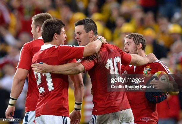 Ben Youngs, Jonathon Sexton and Leigh Halfpenny celebrate victory after the First Test match between the Australian Wallabies and the British & Irish...