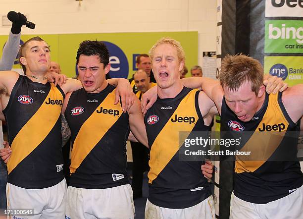 The Tigers sing the team song in the changing rooms after winning the round 13 AFL match between the Western Bulldogs and the Richmond Tigers at...