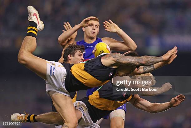 Aaron Edwards of the Tigers attempts to mark the ball during the round 13 AFL match between the Western Bulldogs and the Richmond Tigers at Etihad...