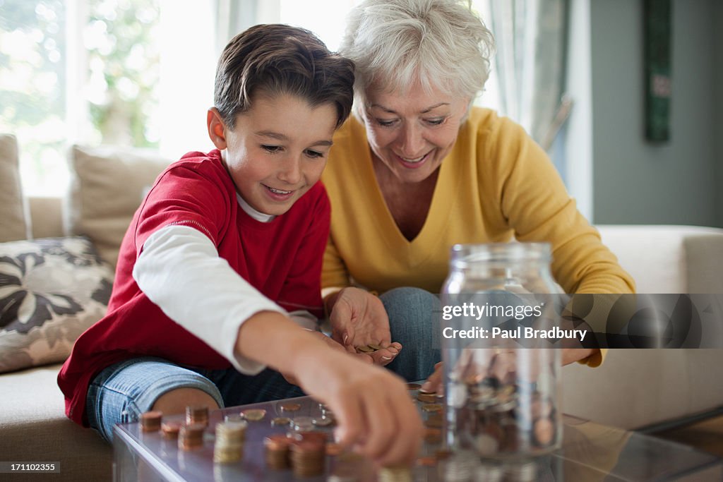 Grandmother and grandson counting coins