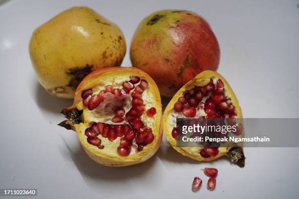 pomegranate punica granatum linn punicaceae fruit - pomegranate stock pictures, royalty-free photos & images