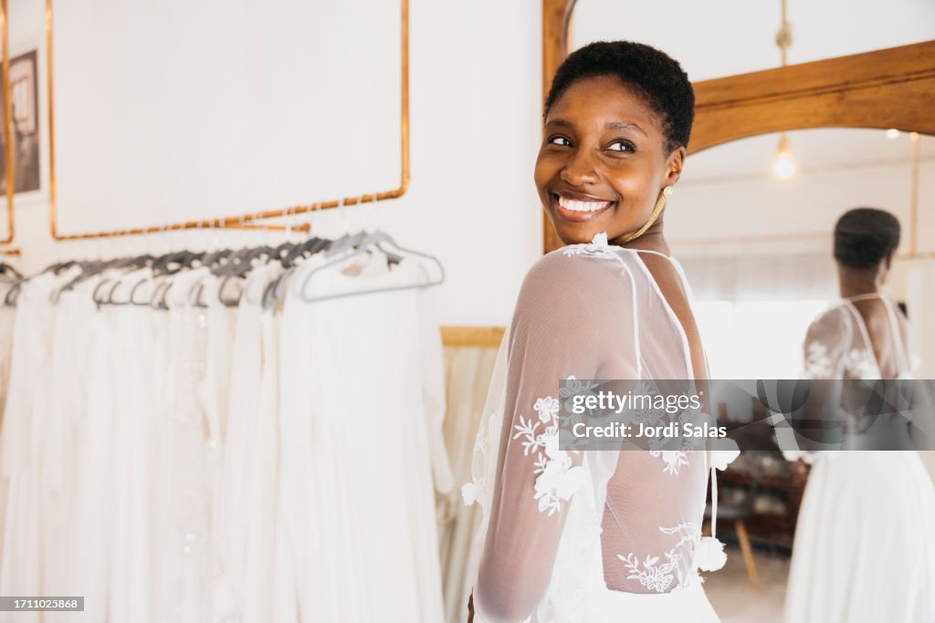 Wedding dress fitting in bridal boutique