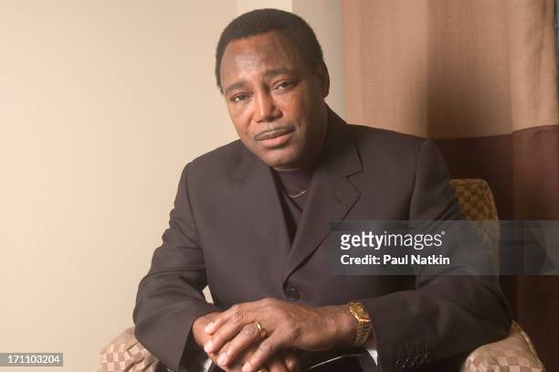Portrait of American jazz and R&B musician George Benson as he poses backstage at the Oriental Theater, Chicago, Illinois, May 1, 2004.