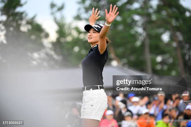 Erika Hara of Japan celebrates winning the tournament on the 18th green following the final round of the Japan Women's Open Golf Championship at...