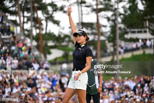 Erika Hara of Japan celebrates winning the tournament on the 18th green following the final round of the Japan Women's Open Golf Championship at...