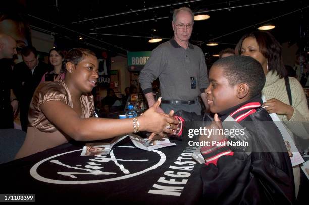 American R&B singer Fantasia Barrino signs autographs during a promotional appearance at Virgin Records, Chicago, Illinois, February 19, 2005.