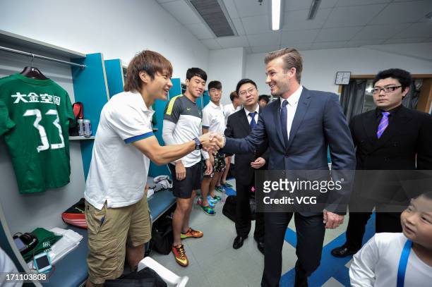 David Beckham visits the changing room of Hangzhou Greentown prior to the Chinese Super League between Hangzhou Greentown and Beijing Guoan at Yellow...