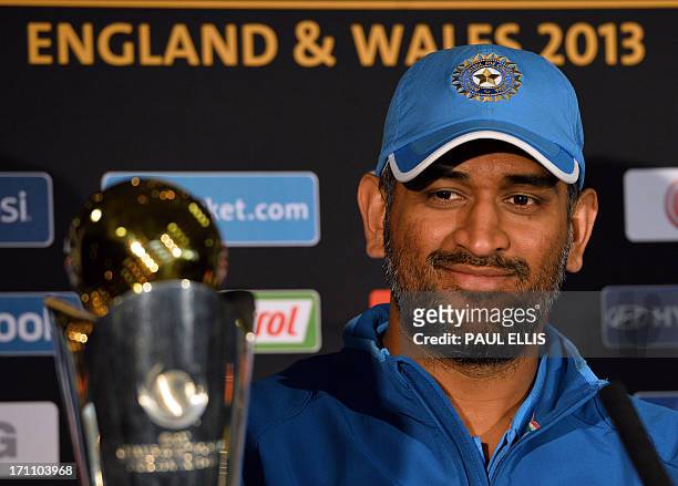 Indian captain Mahendra Sing Dhoni listens to questions during a press conference at Edgbaston in Birmingham, England on June 22, 2013 a day ahead of...