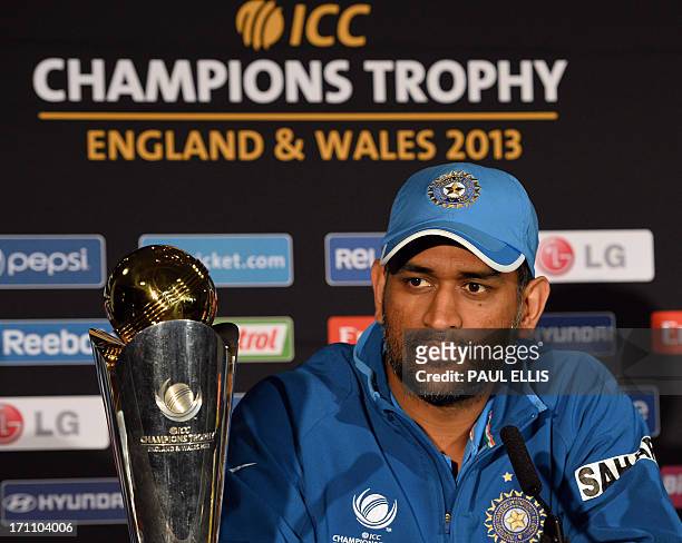 Indian captain Mahendra Sing Dhoni listens to questions during a press conference at Edgbaston in Birmingham, England on June 22, 2013 a day ahead of...
