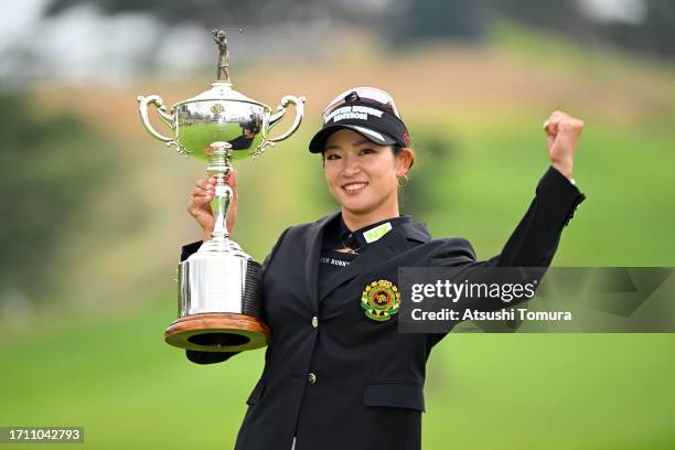 Erika Hara of Japan poses with the trophy after winning the tournament following the final round of the Japan Women's Open Golf Championship at Awara...