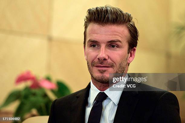 David Beckham accepts the CCTV interview during the Chinese Super League match between Hangzhou Greentown and Beijing Guoan at Yellow Dragon Sports...