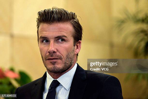 David Beckham accepts the CCTV interview during the Chinese Super League match between Hangzhou Greentown and Beijing Guoan at Yellow Dragon Sports...