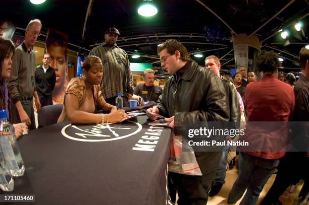 American R&B singer Fantasia Barrino signs autographs during a promotional appearance at Virgin Records, Chicago, Illinois, February 19, 2005.