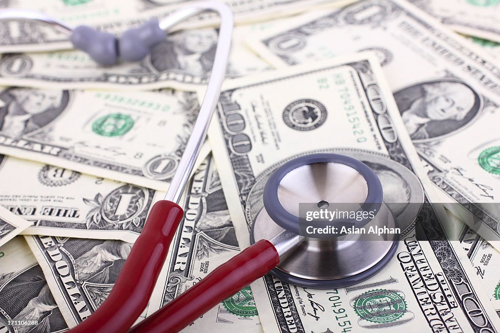 Stethoscope on various monetary denominations
