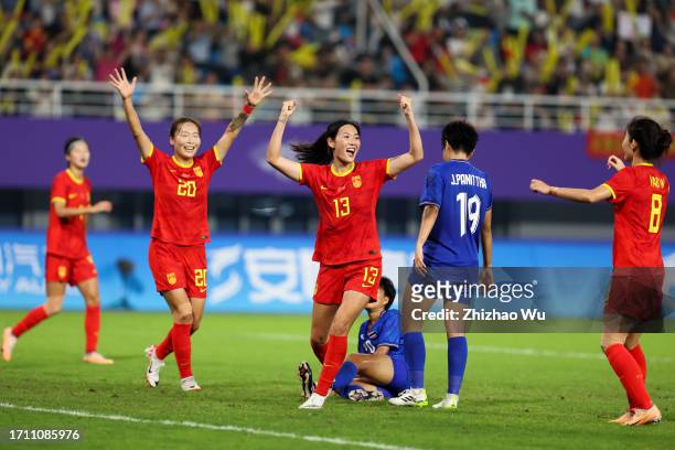 Yang Lina of China celebrates her second goal during the 19th Asian Games Women's Quarterfinal match between China and Thailand at Linping Sports...